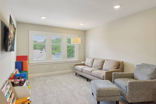 carpeted living room featuring recessed lighting, visible vents, and baseboards