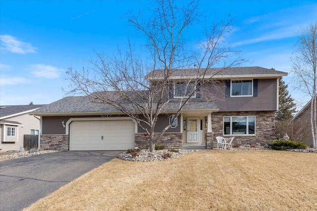 view of front facade featuring aphalt driveway, stone siding, a garage, and a front yard