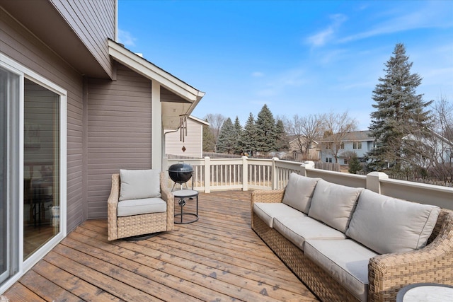 wooden terrace with outdoor lounge area