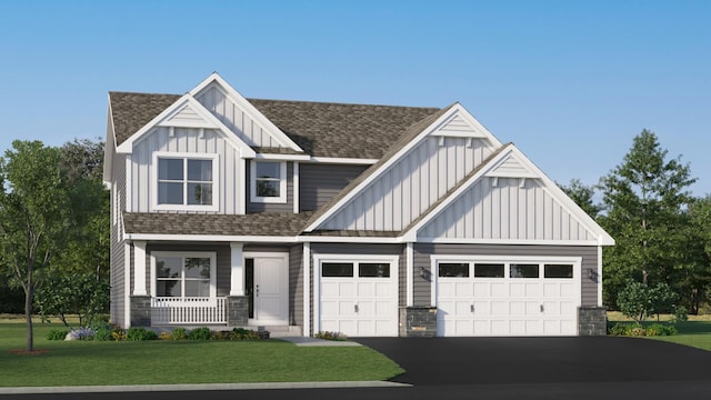 craftsman inspired home featuring a front yard, an attached garage, board and batten siding, and driveway