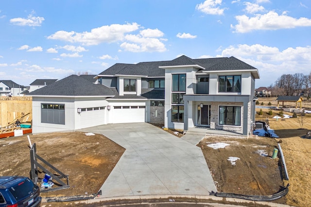 view of front facade featuring stucco siding, driveway, fence, a shingled roof, and a balcony