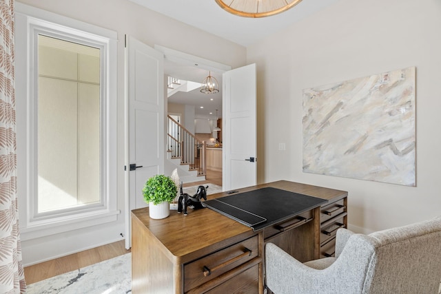 home office with wood finished floors