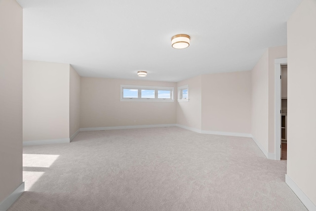 interior space featuring carpet flooring and baseboards