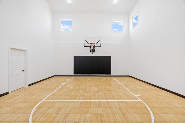 view of sport court with basketball hoop