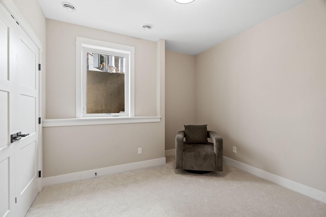 unfurnished room featuring baseboards and carpet floors