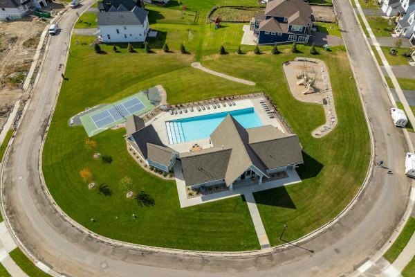 aerial view of residential area with a pool