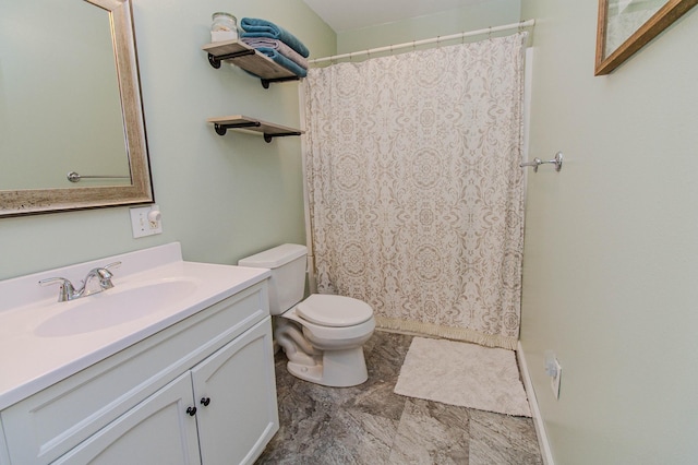 bathroom featuring vanity, a shower with shower curtain, and toilet