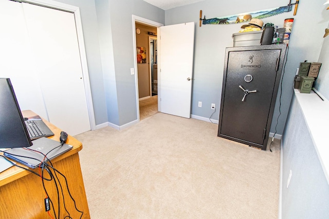 bedroom featuring baseboards and light carpet