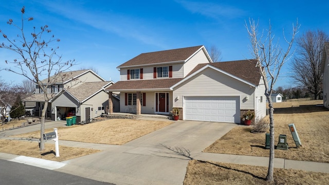 traditional-style house featuring covered porch, driveway, and a garage