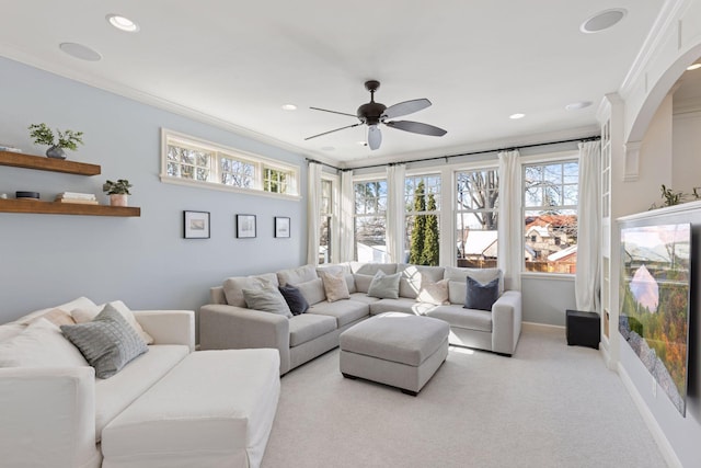 carpeted living room with a ceiling fan, crown molding, recessed lighting, and baseboards