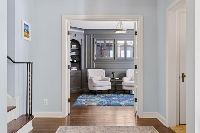 interior space featuring stairway, baseboards, and wood finished floors