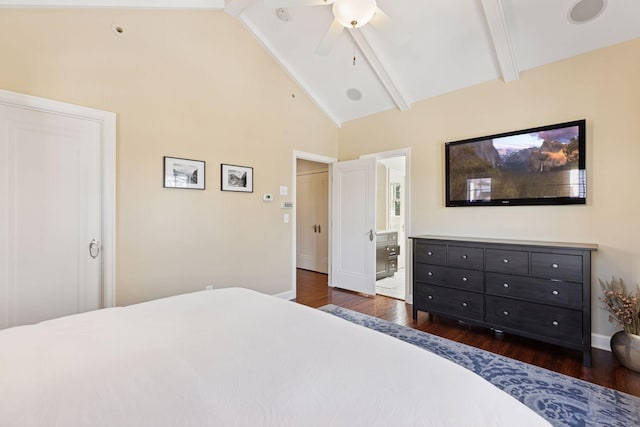 bedroom featuring dark wood finished floors, beam ceiling, high vaulted ceiling, and connected bathroom