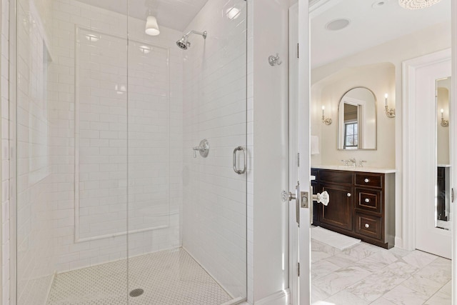 bathroom with vanity, marble finish floor, and a shower stall