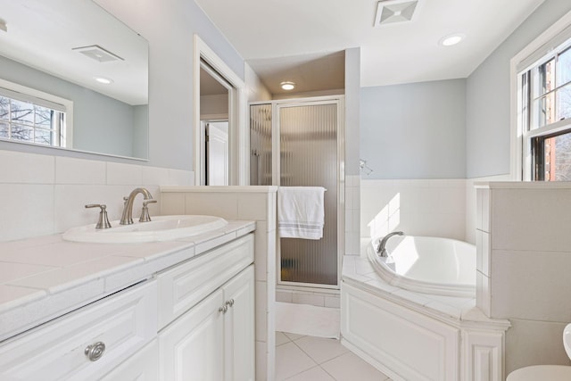 bathroom featuring tile patterned floors, visible vents, and a stall shower