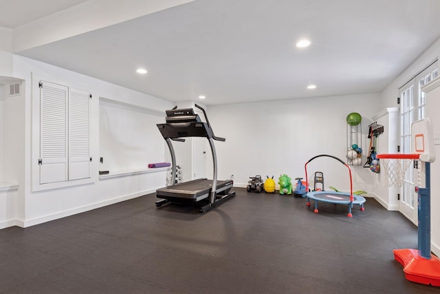 exercise area with recessed lighting, visible vents, and baseboards