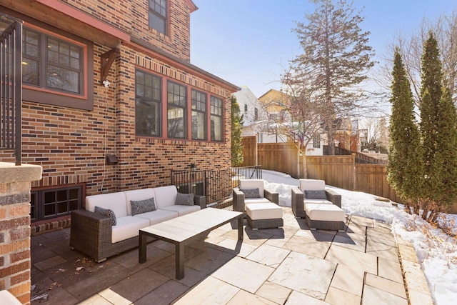 view of patio / terrace featuring an outdoor living space and fence