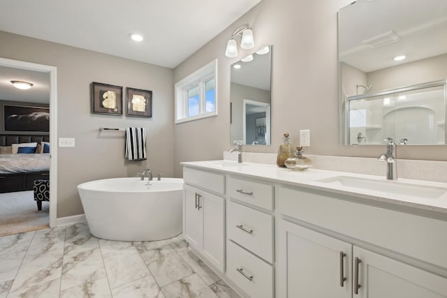 full bath featuring a sink, ensuite bathroom, marble finish floor, and a shower stall