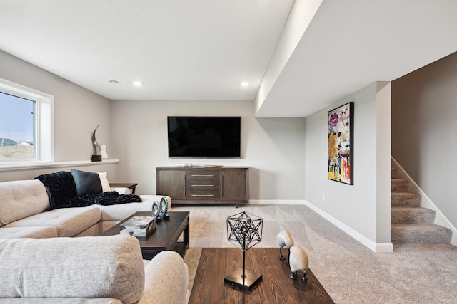 living area with stairway, recessed lighting, baseboards, and light carpet