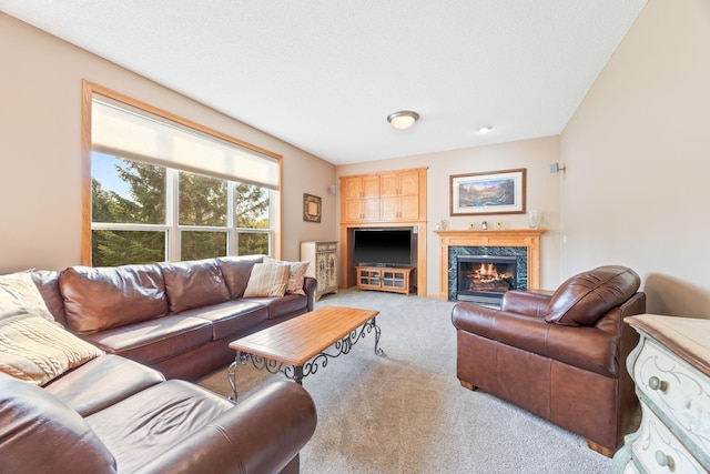 carpeted living room featuring a high end fireplace