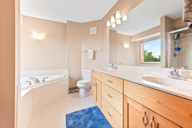 bathroom featuring a sink, a shower stall, tile patterned floors, and double vanity