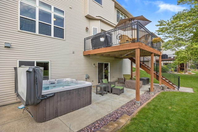 view of patio featuring a deck, stairway, outdoor lounge area, and a hot tub