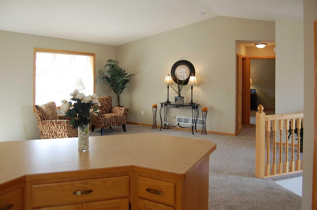 office space with carpet flooring, baseboards, and vaulted ceiling