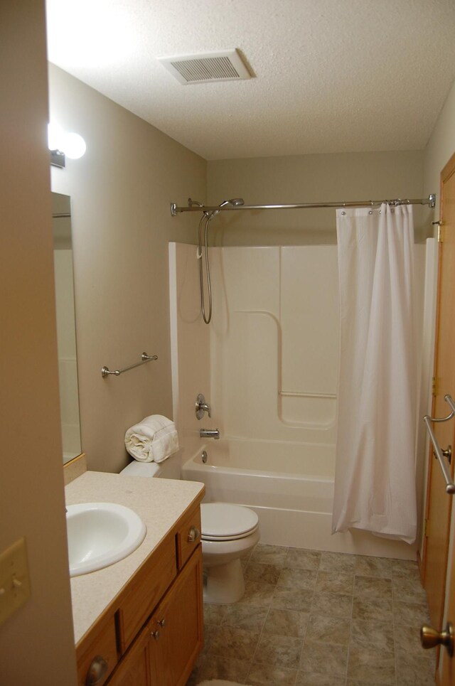 full bath featuring vanity, visible vents, shower / bath combination with curtain, a textured ceiling, and toilet