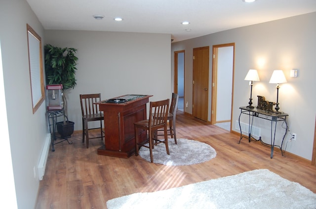 dining area with recessed lighting, wood finished floors, and baseboards