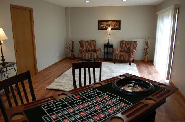 sitting room with recessed lighting and wood finished floors