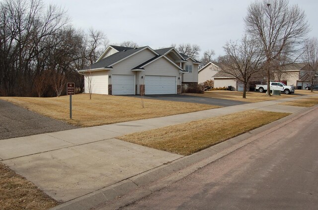 exterior space featuring a front lawn and driveway