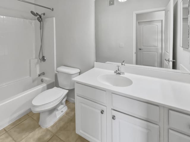 full bath featuring vanity, tile patterned floors, toilet, and washtub / shower combination