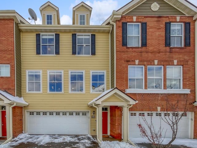 townhome / multi-family property with brick siding