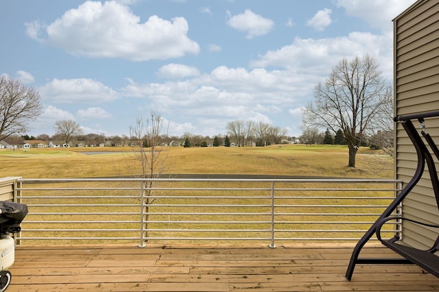 wooden deck with a rural view