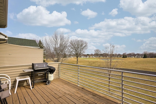 wooden deck featuring a grill