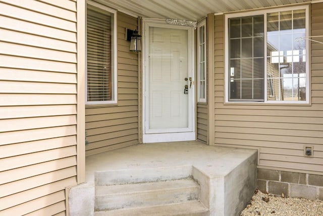 doorway to property with a porch