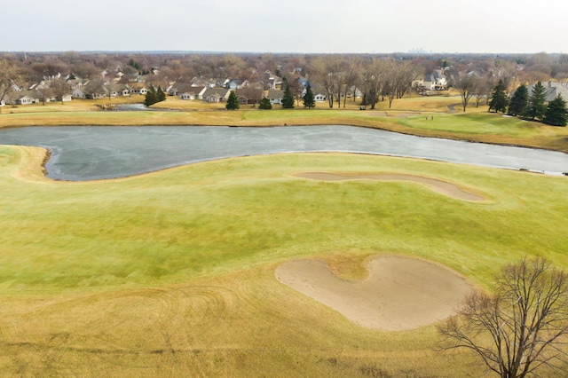 bird's eye view with view of golf course and a water view