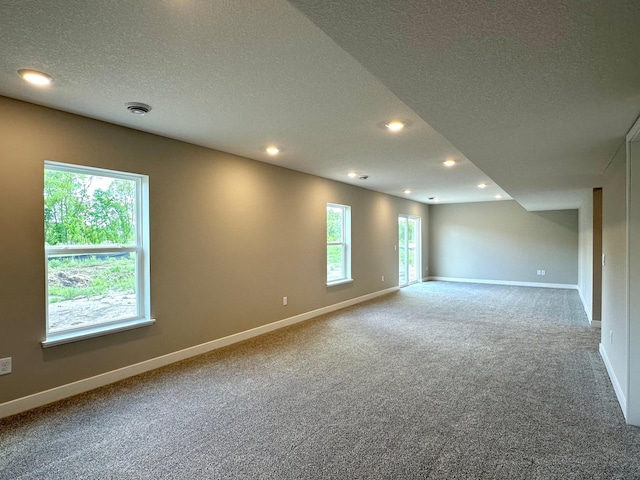 7856 Martin Ave NE, Otsego, MN 55330 - carpeted spare room with a textured ceiling, baseboards, and recessed lighting