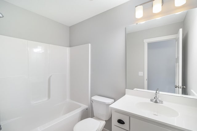 bathroom featuring shower / bathtub combination, toilet, and vanity