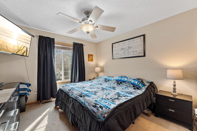 bedroom with baseboards, light carpet, a textured ceiling, and ceiling fan