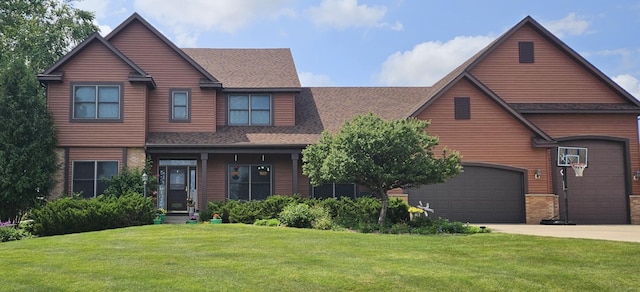 view of front facade featuring a shingled roof, concrete driveway, an attached garage, a front yard, and brick siding