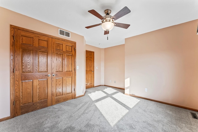 unfurnished bedroom featuring visible vents, ceiling fan, baseboards, and carpet floors