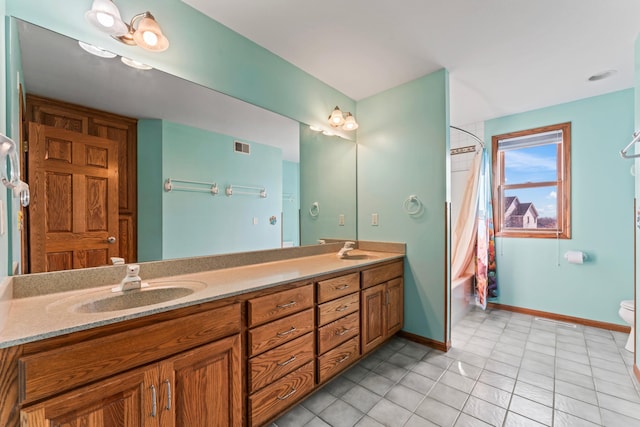 bathroom featuring a sink, baseboards, shower / tub combo with curtain, and double vanity