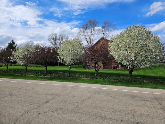 view of road with a barn