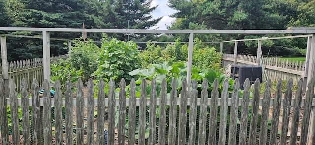 view of gate featuring fence