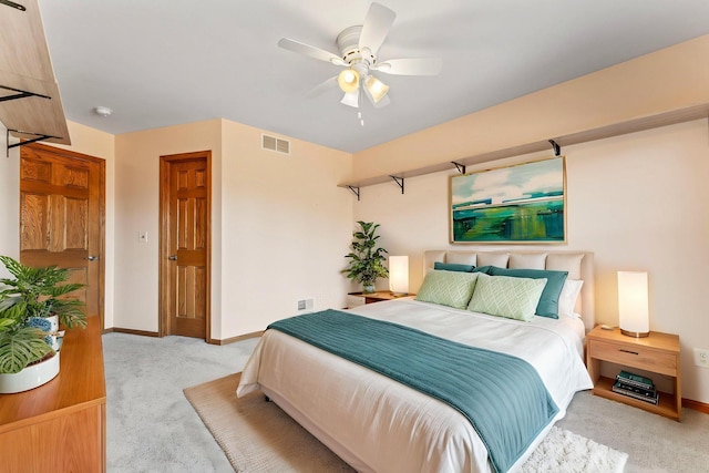 3135 Sherburn Pl SW, Rochester, MN 55902 - bedroom with light colored carpet, baseboards, and a ceiling fan