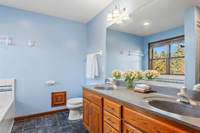 3135 Sherburn Pl SW, Rochester, MN 55902 - full bath with toilet, tile patterned floors, baseboards, a bath, and double vanity