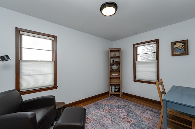 home office featuring baseboards and wood finished floors