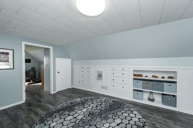 bonus room featuring visible vents, lofted ceiling, baseboards, and dark wood-style floors