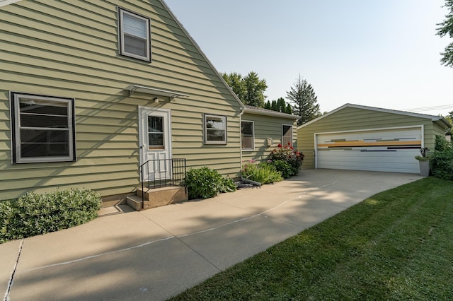 exterior space with an outdoor structure and a detached garage