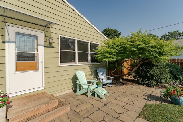 view of patio / terrace with entry steps and fence